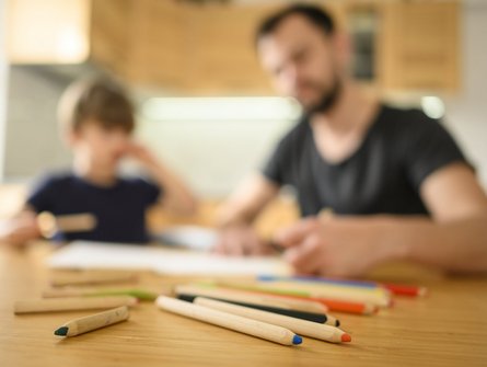 blurred-father-son-table